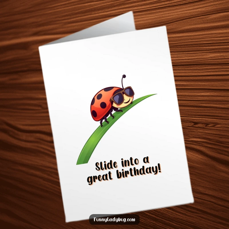 Funny Free Printable Birthday Card: Ladybug in sunglasses coolly sliding down a lush green blade of grass.